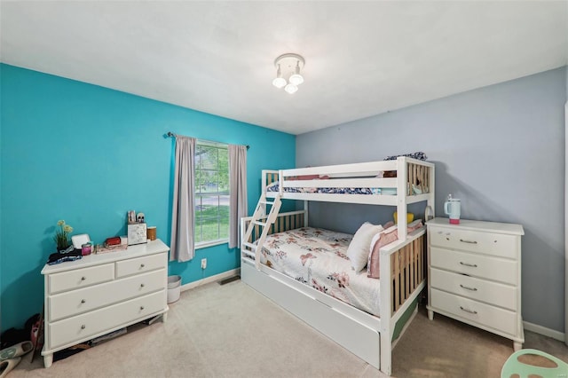 carpeted bedroom featuring baseboards