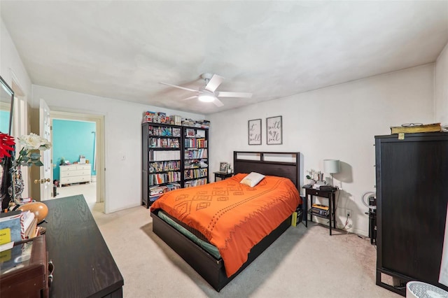 carpeted bedroom with a ceiling fan