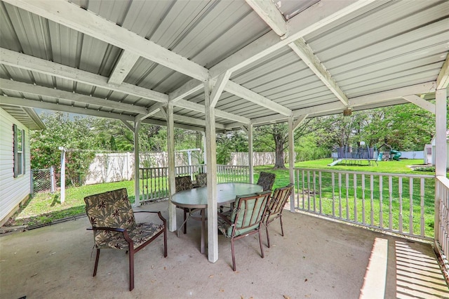 sunroom / solarium featuring outdoor dining space