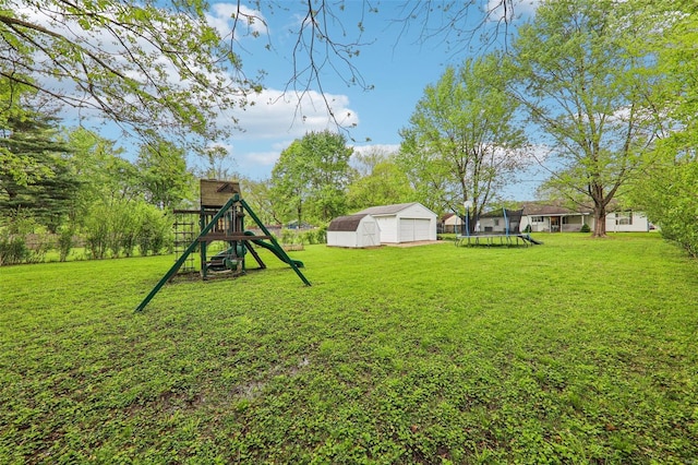 view of yard with a storage unit, a trampoline, a detached garage, an outbuilding, and a playground