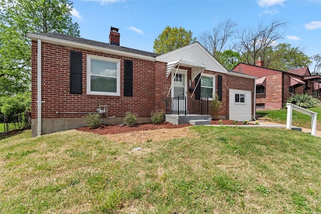 view of front facade with brick siding, fence, a front yard, and a chimney