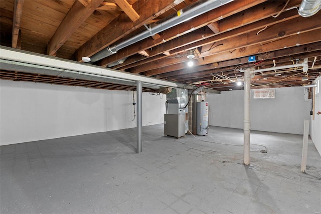 below grade area featuring heating unit and gas water heater