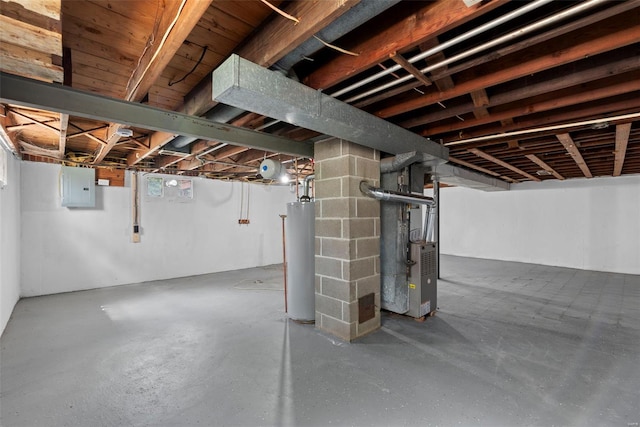below grade area with heating unit, water heater, and electric panel