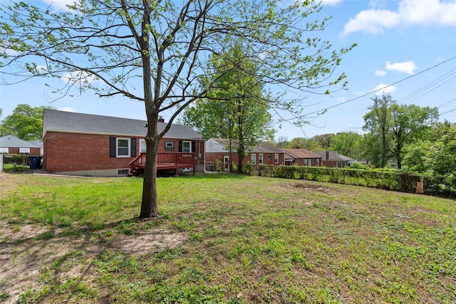 view of yard with fence and a wooden deck