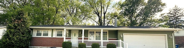 single story home with concrete driveway, a porch, brick siding, and an attached garage