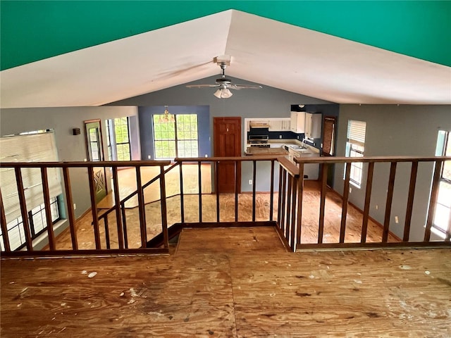 interior space with a ceiling fan and lofted ceiling