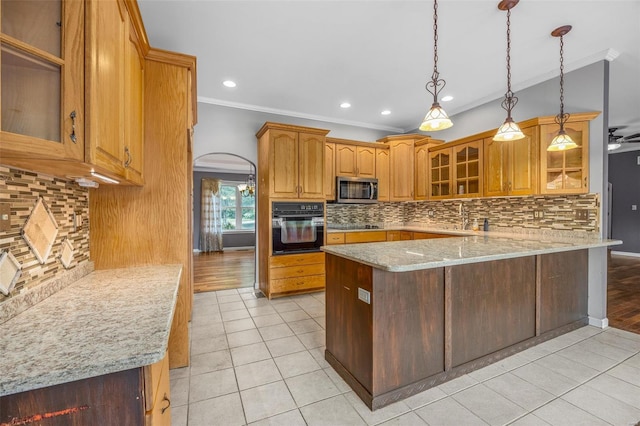 kitchen with crown molding, light tile patterned floors, tasteful backsplash, and black appliances