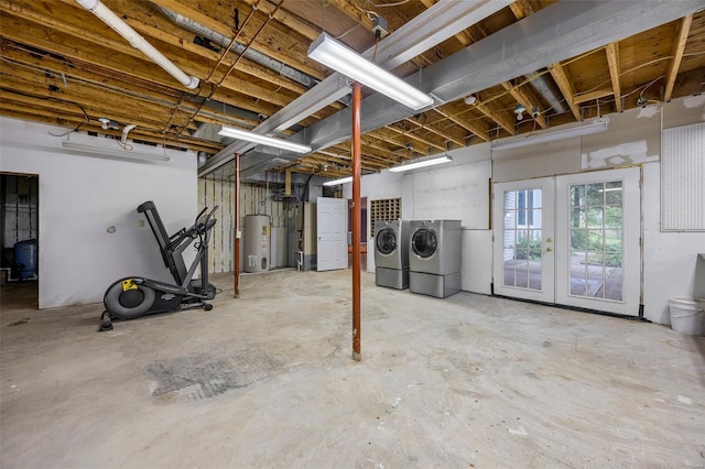 below grade area with water heater, french doors, and independent washer and dryer