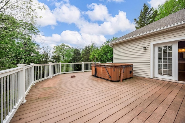 wooden deck featuring a hot tub