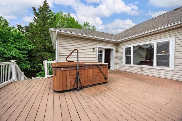deck featuring a hot tub