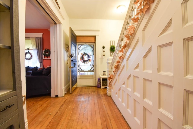 interior space featuring baseboards and light wood-type flooring
