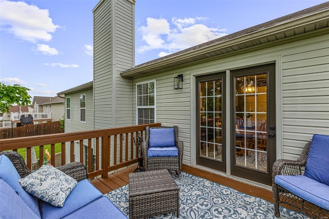 wooden terrace featuring fence