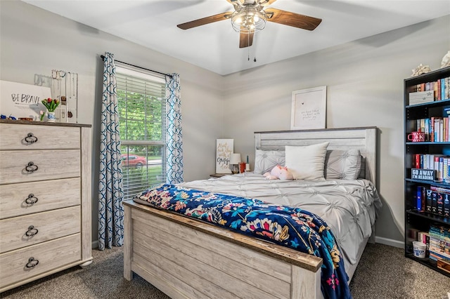 carpeted bedroom with baseboards and a ceiling fan
