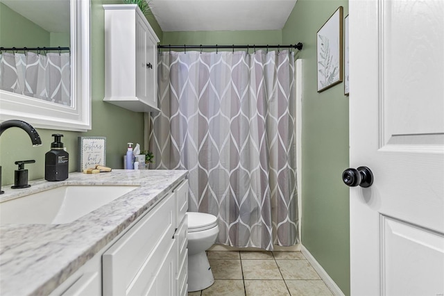 bathroom featuring toilet, curtained shower, baseboards, tile patterned flooring, and vanity