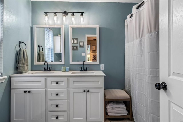 full bath with double vanity and a sink