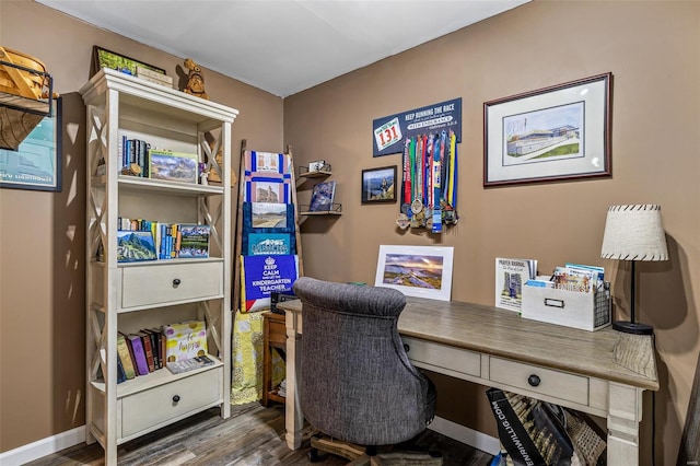 office space featuring wood finished floors and baseboards