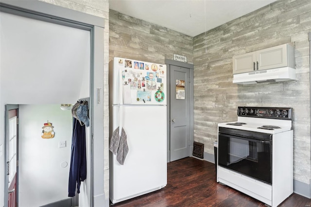 kitchen featuring freestanding refrigerator, dark wood-style flooring, under cabinet range hood, white cabinets, and electric stove