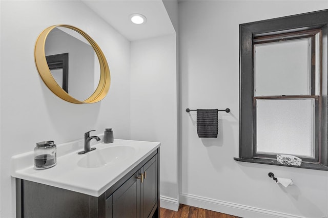 bathroom with vanity and wood finished floors