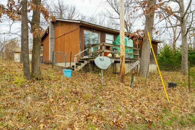 view of outbuilding with fence