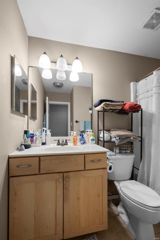 full bathroom with visible vents, vanity, toilet, a shower with shower curtain, and tile patterned floors