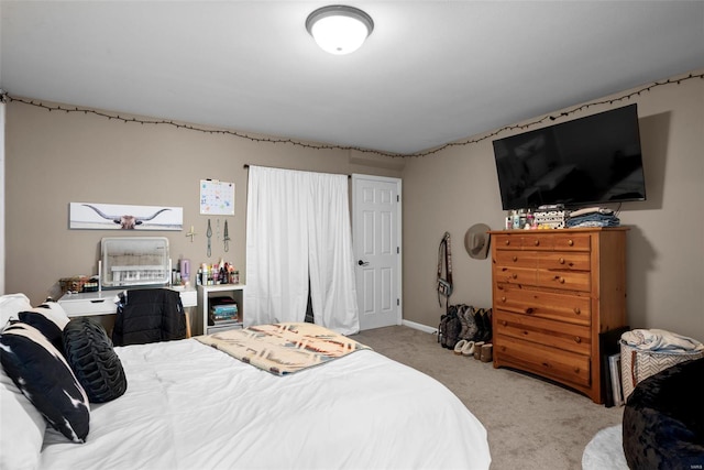 bedroom with light colored carpet