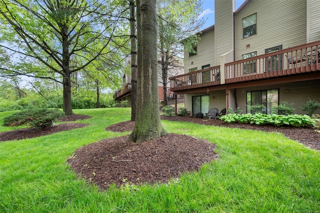 view of yard with a wooden deck