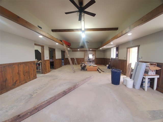interior space featuring recessed lighting, wood walls, wainscoting, and beam ceiling