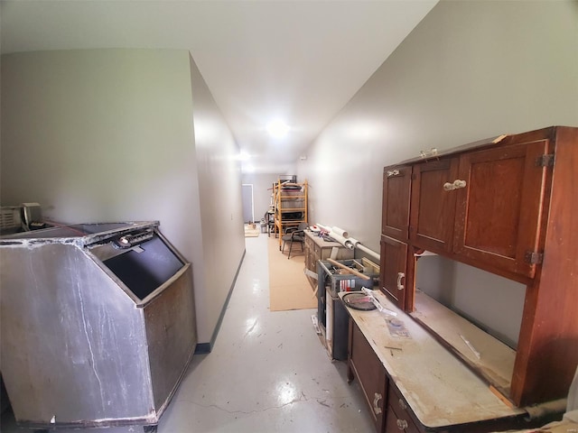 interior space with baseboards and concrete flooring