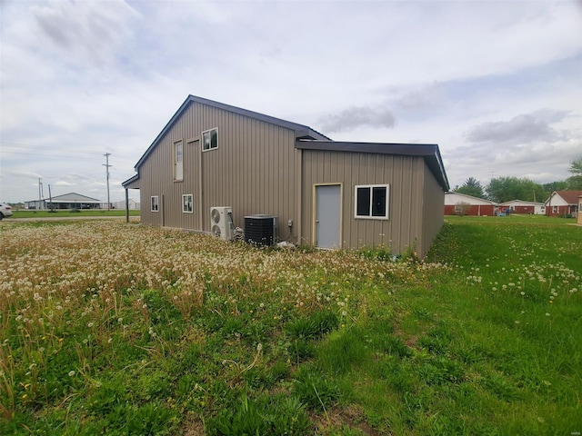 view of outbuilding with cooling unit and ac unit