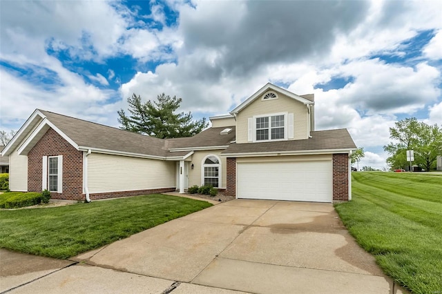 view of front of home with brick siding, an attached garage, a front yard, and concrete driveway