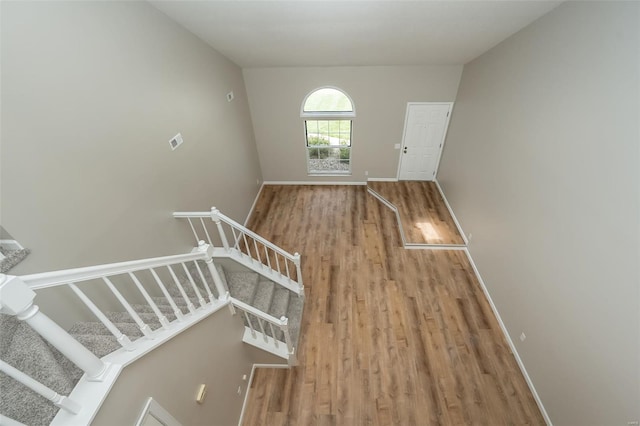 interior space featuring baseboards and wood finished floors