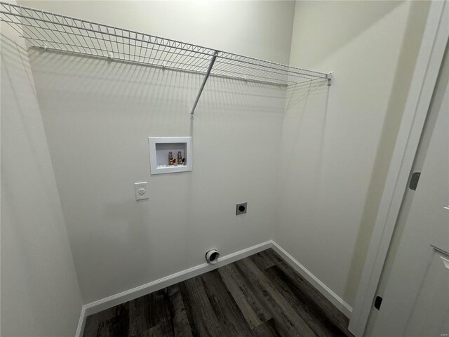 clothes washing area featuring laundry area, baseboards, hookup for a washing machine, dark wood finished floors, and hookup for an electric dryer