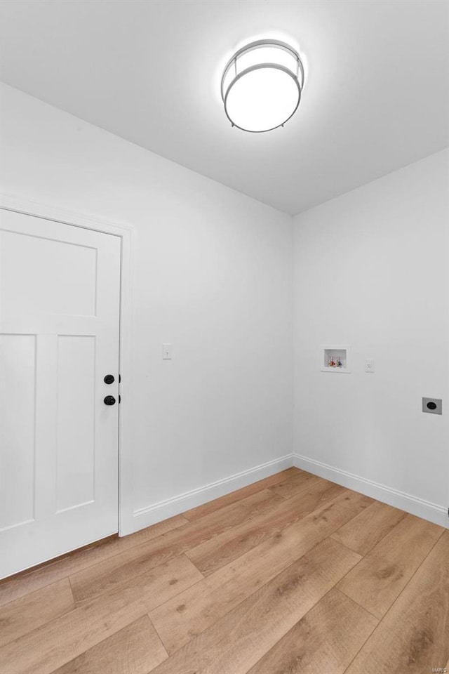 washroom with laundry area, electric dryer hookup, light wood-type flooring, baseboards, and hookup for a washing machine