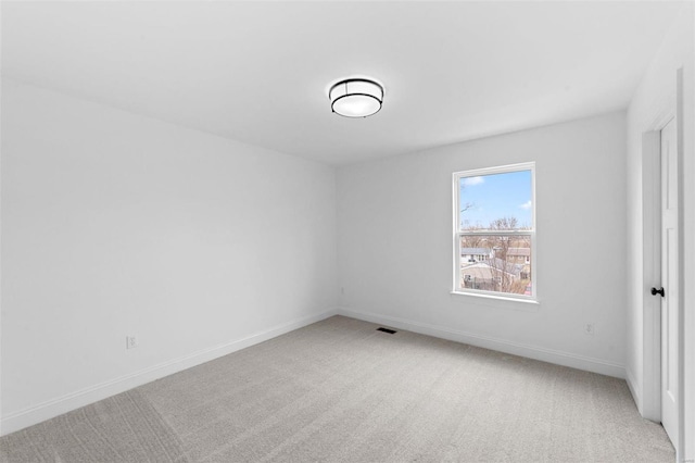 unfurnished bedroom with baseboards and light carpet