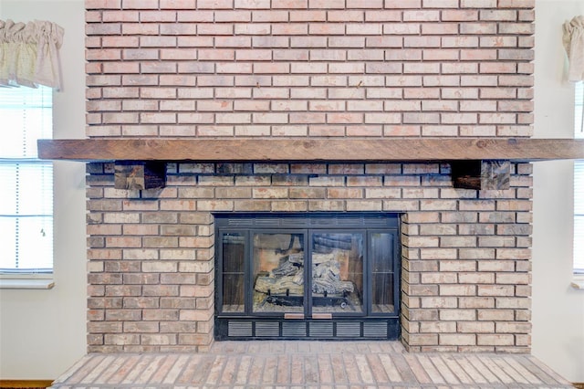 details with a brick fireplace