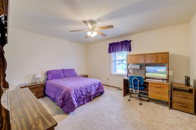 bedroom with ceiling fan and light carpet
