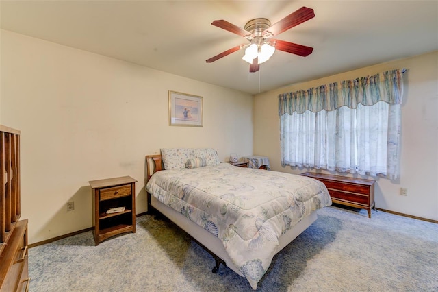 bedroom featuring baseboards, ceiling fan, and carpet floors