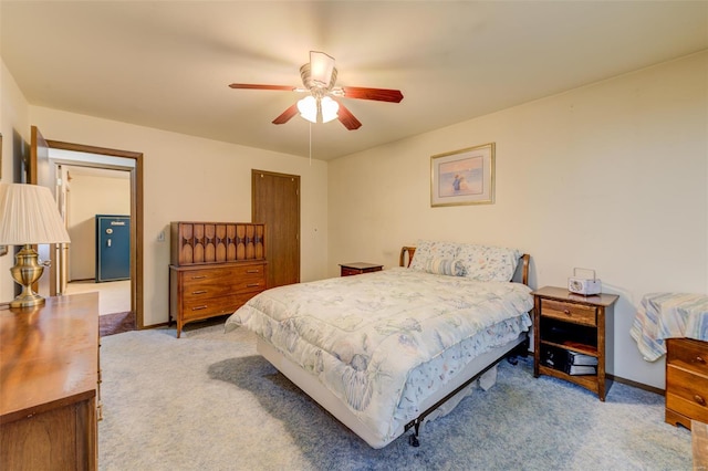 bedroom with carpet, baseboards, and ceiling fan