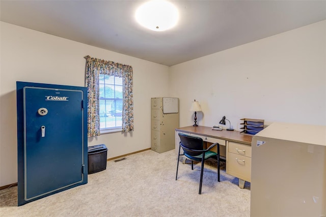 home office featuring light carpet, baseboards, and visible vents
