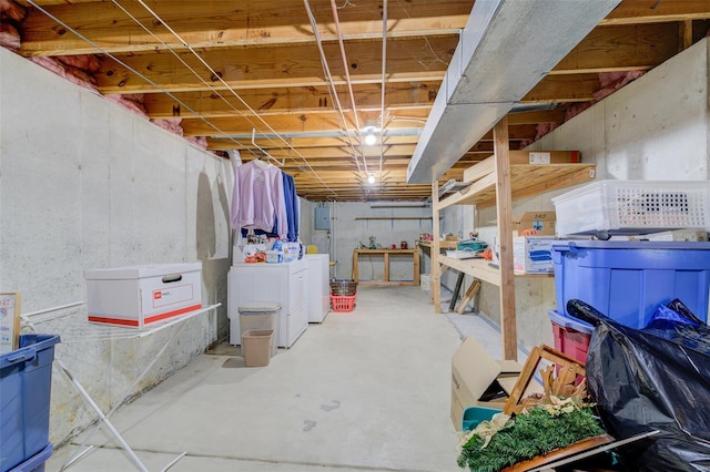 unfinished basement featuring washing machine and dryer