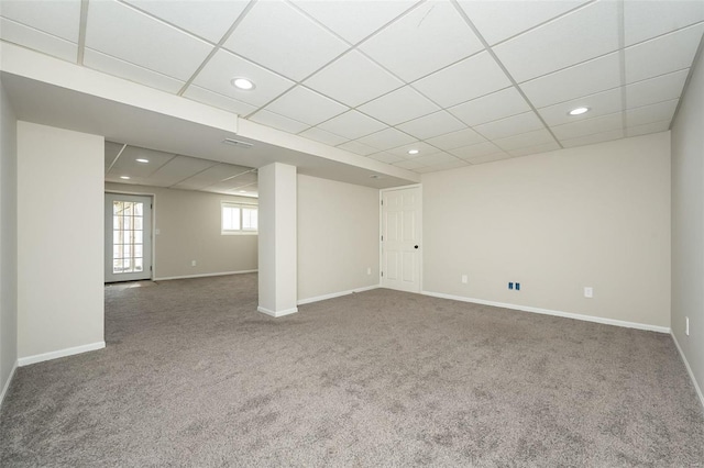 basement featuring recessed lighting, carpet flooring, baseboards, and a drop ceiling