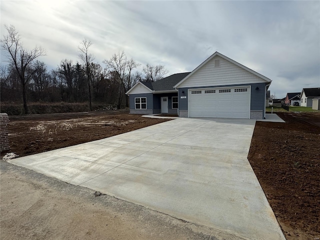 view of front of house with an attached garage and driveway