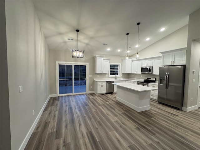 kitchen featuring a sink, recessed lighting, dark wood-style flooring, light countertops, and appliances with stainless steel finishes