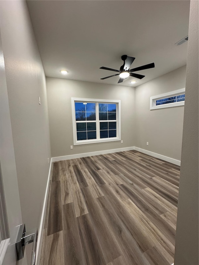 unfurnished room featuring a ceiling fan, recessed lighting, baseboards, visible vents, and wood finished floors
