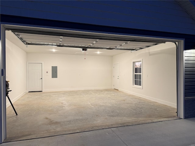 garage with electric panel and a garage door opener