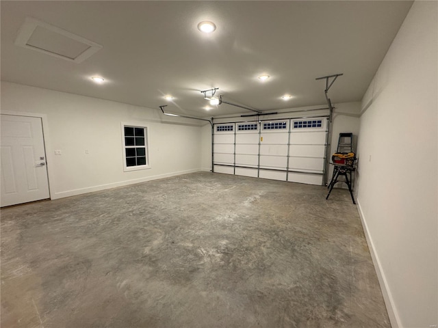 garage with baseboards, recessed lighting, and a garage door opener