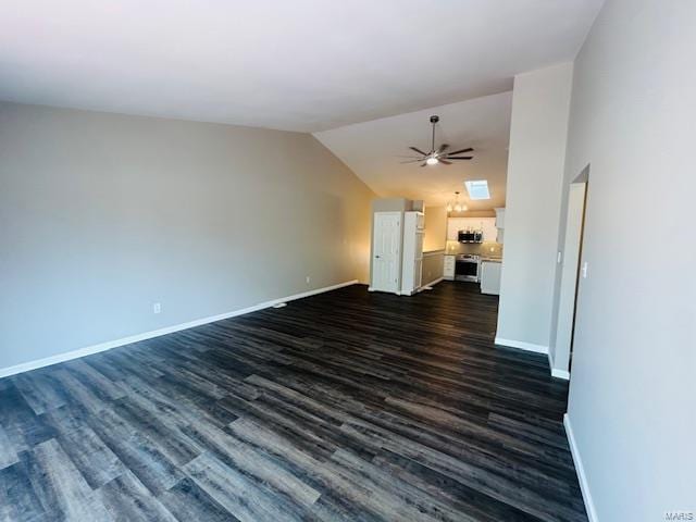 unfurnished living room featuring baseboards, a ceiling fan, dark wood finished floors, and lofted ceiling