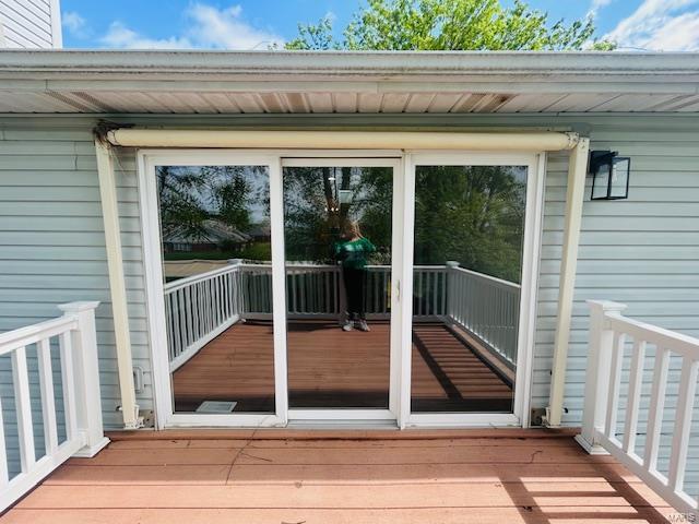 doorway to property with a wooden deck