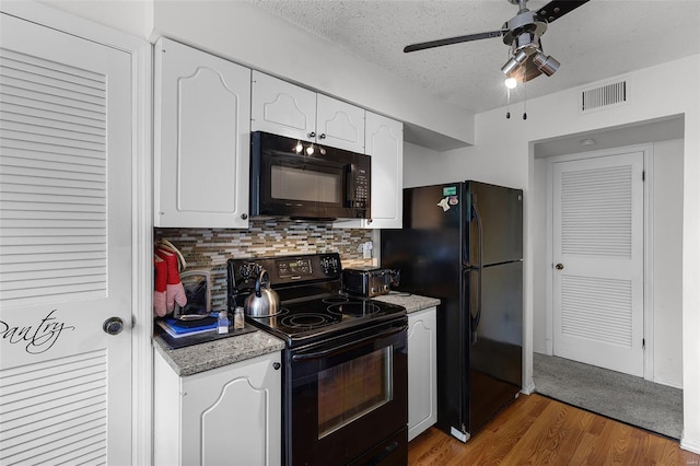 kitchen featuring visible vents, ceiling fan, white cabinetry, backsplash, and black appliances