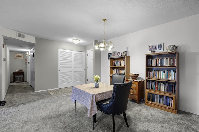 dining space featuring visible vents, baseboards, a textured ceiling, a chandelier, and carpet flooring